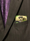 Folded pocket square with ace of spades showing out of suit jacket breast pocket