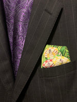 Folded pocket square with poker chips showing out of suit jacket breast pocket