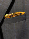 Pocket square with an image of the Plaza Mayor in Madrid with buildings in background and horse statue on pedestal in foreground in blue, black, brown and gold.