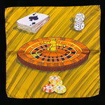 Pocket square with roulette wheel, deck of cards, dice and poker chips on a light gold background