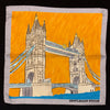 Sketched image of Tower Bridge in London in sandstone against an orange sky with a silver border