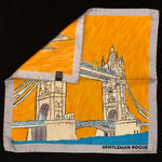 Sketched image of Tower Bridge in London in sandstone against an orange sky with a silver border