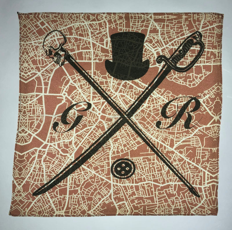 Pocket square with vector image of London city map in dusty pink with Gentleman Rogue logo superimposed on top